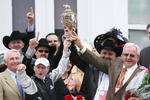 LOUISVILLE, KY - MAY 02:  (L) Jockey Calvin Borel holds the 135th Kentucky Derby trophy with owner Leonard Blach after his win atop Mine That Bird in the winner's circle on May 2, 2009 at Churchill Downs in Louisville, Kentucky.  (Photo by Andy Lyons/Getty Images)