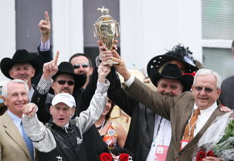 LOUISVILLE, KY - MAY 02:  (L) Jockey Calvin Borel holds the 135th Kentucky Derby trophy with owner Leonard Blach after his win atop Mine That Bird in the winner's circle on May 2, 2009 at Churchill Downs in Louisville, Kentucky.  (Photo by Andy Lyons/Getty Images)