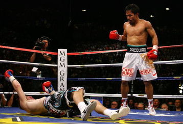 LAS VEGAS - MAY 02:  (R-L) Manny Pacquiao of the Philippines stands over Ricky Hatton of England after Pacquiao knocked him out in the second round during their junior welterweight title fight at the MGM Grand Garden Arena May 2, 2009 in Las Vegas, Nevada.  (Photo by Al Bello/Getty Images)