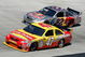 BRISTOL, TN - MARCH 22: Marcos Ambrose, driver of the #47 Little Debbie/Clorox/Kingsford Toyota, races Scott Speed, driver of the #82 Red Bull Toyota, during the NASCAR Sprint Cup Series Food City 500 at Bristol Motor Speedway on March 22, 2009 in Bristol, Tennessee.  (Photo by Geoff Burke/Getty Images for NASCAR)