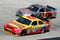 BRISTOL, TN - MARCH 22: Marcos Ambrose, driver of the #47 Little Debbie/Clorox/Kingsford Toyota, races Scott Speed, driver of the #82 Red Bull Toyota, during the NASCAR Sprint Cup Series Food City 500 at Bristol Motor Speedway on March 22, 2009 in Bristol, Tennessee.  (Photo by Geoff Burke/Getty Images for NASCAR)