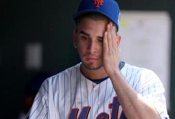 NEW YORK - APRIL 26:  Oliver Perez #46 of the New York Mets reacts in the dugout after he was taken out of their game against the Washington Nationals in the fifth inning on April 26, 2009 at Citi Field in the Flushing neighborhood of the Queens borough of New York City.  (Photo by Ezra Shaw/Getty Images)