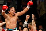 LAS VEGAS - MAY 02:  Manny Pacquiao of the Philippines celebrates after knocking out Ricky Hatton of England in the second round of their junior welterweight title fight at the MGM Grand Garden Arena May 2, 2009 in Las Vegas, Nevada.  (Photo by Ethan Miller/Getty Images)