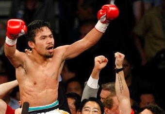 LAS VEGAS - MAY 02:  Manny Pacquiao of the Philippines celebrates after knocking out Ricky Hatton of England in the second round of their junior welterweight title fight at the MGM Grand Garden Arena May 2, 2009 in Las Vegas, Nevada.  (Photo by Ethan Miller/Getty Images)