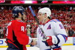 WASHINGTON - APRIL 28:  Alex Ovechkin #8 of the Washington Capitals shakes the hand of Markus Naslund #91 of the New York Rangers after defeating him during Game Seven of the Eastern Conference Quarterfinal Round of the 2009 Stanley Cup Playoffs on April 28, 2009 at the Verizon Center in Washington,  DC.  (Photo by Len Redkoles/Getty Images)