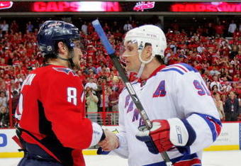 WASHINGTON - APRIL 28:  Alex Ovechkin #8 of the Washington Capitals shakes the hand of Markus Naslund #91 of the New York Rangers after defeating him during Game Seven of the Eastern Conference Quarterfinal Round of the 2009 Stanley Cup Playoffs on April 28, 2009 at the Verizon Center in Washington,  DC.  (Photo by Len Redkoles/Getty Images)