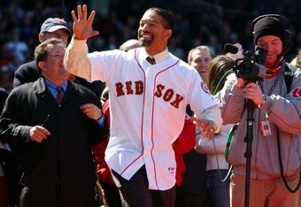 BOSTON - APRIL 11:  Former Red Sox pinch runner Dave Roberts waves to the crowd April 11, 2005 while receiving his championship ring at Fenway Park in Boston, Massachusetts. The Red Sox also raised the championship banner in their home opener against the New York Yankees. (Photo by Darren McCollester/Getty Images)