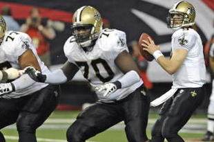 ATLANTA - NOVEMBER 9: Quarterback Drew Brees #9 of the New Orleans Saints sets to pass behind the block of tackle Jammal Brown #70 against the Atlanta Falcons at the Georgia Dome on November 9, 2008 in Atlanta, Georgia.  (Photo by Al Messerschmidt/Getty Images) 