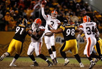PITTSBURGH - DECEMBER 07:  Derek Anderson #3 of the Cleveland Browns throws a pass under pressure from Aaron Smith #91 and Casey Hampton #98 of the Pittsburgh Steelers December 7, 2006 at Heinz Field in Pittsburgh, Pennsylvania.  (Photo by Gregory Shamus/Getty Images)