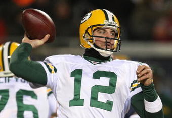 CHICAGO - DECEMBER 22: Aaron Rodgers #12 of the Green Bay Packers throws a pass against the Chicago Bears on December 22, 2008 at Soldier Field in Chicago, Illinois. The Bears defeated the Packers 20-17 in overtime. (Photo by Jonathan Daniel/Getty Images)