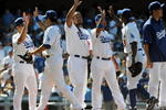LOS ANGELES, CA - MAY 03:  Manny Ramirez #99 of the Los Angeles Dodgers celebrates a 7-3 victory over the San Diego Padres with teammates at Dodger Stadium on May 3, 2009 in Los Angeles, California.  (Photo by Harry How/Getty Images)