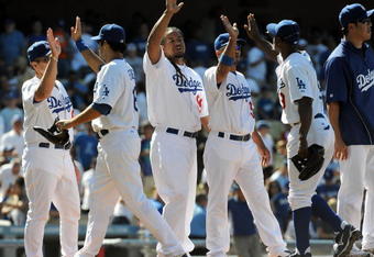 LOS ANGELES, CA - MAY 03:  Manny Ramirez #99 of the Los Angeles Dodgers celebrates a 7-3 victory over the San Diego Padres with teammates at Dodger Stadium on May 3, 2009 in Los Angeles, California.  (Photo by Harry How/Getty Images)