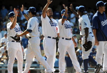 LOS ANGELES, CA - MAY 03:  Manny Ramirez #99 of the Los Angeles Dodgers celebrates a 7-3 victory over the San Diego Padres with teammates at Dodger Stadium on May 3, 2009 in Los Angeles, California.  (Photo by Harry How/Getty Images)