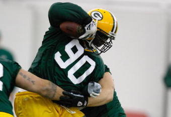GREEN BAY, WI - MAY 1:  Defensive lineman B.J. Raji #90 runs with the football as he participates in practice drills during Green Bay Packers Minicamp at Don Hutson Center on May 1, 2009 in Green Bay, Wisconsin. (Photo by Scott Boehm/Getty Images)