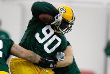 GREEN BAY, WI - MAY 1:  Defensive lineman B.J. Raji #90 runs with the football as he participates in practice drills during Green Bay Packers Minicamp at Don Hutson Center on May 1, 2009 in Green Bay, Wisconsin. (Photo by Scott Boehm/Getty Images)
