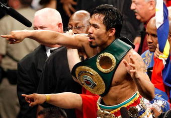 LAS VEGAS - MAY 02:  Manny Pacquiao of the Philippines celebrates after knocking out Ricky Hatton of England in the second round of their junior welterweight title fight at the MGM Grand Garden Arena May 2, 2009 in Las Vegas, Nevada.  (Photo by Ethan Miller/Getty Images)
