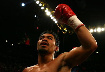 LAS VEGAS - MAY 02:  Manny Pacquiao of the Philippines reacts after knocking down Ricky Hatton of England in the second round during their junior welterweight title fight at the MGM Grand Garden Arena May 2, 2009 in Las Vegas, Nevada.  (Photo by Al Bello/Getty Images)