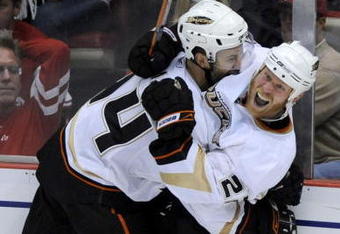 DETROIT - MAY 03:  Todd Merchant #22 of the Anaheim Ducks celebrates his game winning goal in the third overtime with Rob Niedermayer #44 to beat the Detroit Red Wings 4-3 in Game Two of the Western Conference Semifinals of the 2009 NHL Stanley Cup Playoffs on May 3, 2009 at Joe Louis Arena in Detroit, Michigan.  (Photo by Gregory Shamus/Getty Images)