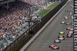 INDIANAPOLIS - MAY 25:  Scott Dixon, driver of the #9 Target Chip Ganassi Racing Dallara Honda, leads the pack with teammate Dan Wheldon, driver of the #10 Target Chip Ganassi Racing Dallara Honda, at the final re-start during the IRL IndyCar Series 92nd running of the Indianapolis 500 at Indianapolis Motor Speedway on May 25, 2008 in Indianapolis, Indiana. (Photo by Donald Miralle/Getty Images)