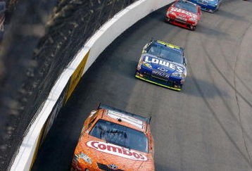 RICHMOND, VA - MAY 02:  Kyle Busch, driver of the #18 Combos Toyota, leads Jimmie Johnson, driver of the #48 Lowe's Chevrolet, during the NASCAR Sprint Cup Series Crown Royal Presents the Russ Friedman 400 at Richmond International Raceway on May 2, 2009 in Richmond, Virginia.  (Photo by Jason Smith/Getty Images)
