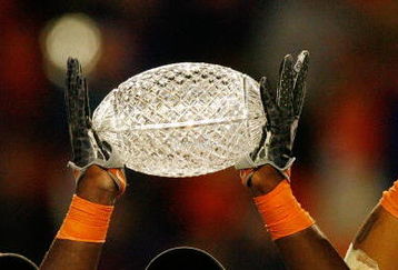 MIAMI - JANUARY 08:  Major Wright #21 and the Florida Gators celebrate with the trophy after defeating the Oklahoma Sooners in the FedEx BCS National Championship Game at Dolphin Stadium on January 8, 2009 in Miami, Florida. The Gators won the game by a score of 24-14.  (Photo by Eliot J. Schechter/Getty Images)