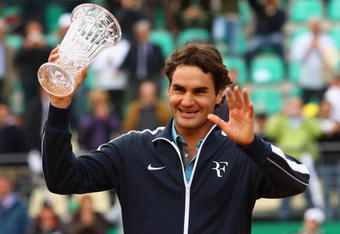 ROME - APRIL 30:  Roger Federer of Switzerland receives two trophies after his match, ATPWorldTour.com Fans favourite and The Stefan Edberg Sportsmanship award during day four of the Foro Italico Tennis Masters on April 30, 2009 in Rome, Italy.  (Photo by Julian Finney/Getty Images)