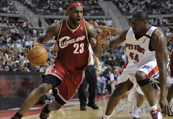 AUBURN HILLS, MI - APRIL 26:  LeBron James #23 of the Cleveland Cavaliers drives around Jason Maxiell #54 of the Detroit Pistons in Game Four of the Eastern Conference Quarterfinals during the 2009 NBA Playoffs at the Palace of Auburn Hills on April 26, 2009 in Auburn Hills, Michigan. NOTE TO USER: User expressly acknowledges and agrees that, by downloading and or using this photograph, User is consenting to the terms and conditions of the Getty Images License Agreement.  (Photo by Gregory Shamus/Getty Images)