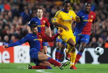 BARCELONA, SPAIN - APRIL 28:  Gerard Pique of Barcelona tackles Didier Drogba of Chelsea during the UEFA Champions League Semi Final First Leg match between Barcelona and Chelsea at the Nou Camp Stadium on April 28, 2009 in Barcelona, Spain.  (Photo by Jasper Juinen/Getty Images)