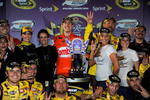 RICHMOND, VA - MAY 02:  Kyle Busch, driver of the #18 Combos Toyota, celebrates in victory lane with his crew after winning the NASCAR Sprint Cup Series Crown Royal Presents the Russ Friedman 400 at Richmond International Raceway on May 2, 2009 in Richmond, Virginia.  (Photo by Rusty Jarrett/Getty Images for NASCAR)