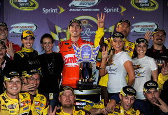 RICHMOND, VA - MAY 02:  Kyle Busch, driver of the #18 Combos Toyota, celebrates in victory lane with his crew after winning the NASCAR Sprint Cup Series Crown Royal Presents the Russ Friedman 400 at Richmond International Raceway on May 2, 2009 in Richmond, Virginia.  (Photo by Rusty Jarrett/Getty Images for NASCAR)