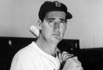 BOSTON - AUGUST 22, 1958:  (FILE PHOTO) Baseball legend Ted Williams (1918 - 2002) of the Boston Red Sox holds a baseball bat at Shriner's Day in Fenway Park August 22, 1958 in Boston, Massachusetts. The 83-year-old Williams, who was the last major league player to bat .400 when he hit .406 in 1941, died July 5, 2002 at Citrus County Memorial Hospital in Florida. He died of an apparent heart attack.  (Photo by Getty Images) 