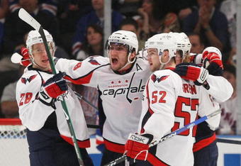 NEW YORK - APRIL 26: (L-R) Alexaner Semin #28,  Alex Ovechkin #8, Nicklas Backstrom #19 and Mike Green #52 of the Washington Capitals celebrate their goal at 16:44 of the second period against the New York Rangers during Game Six of the Eastern Conference Quarterfinal Round of the 2009 NHL Stanley Cup Playoffs at Madison Square Garden on April 26, 2009 in New York, New York. (Photo by Bruce Bennett/Getty Images)