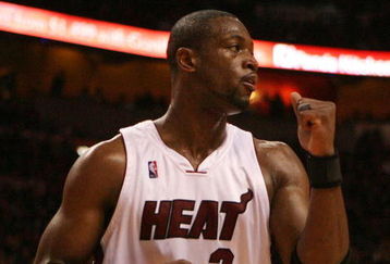 MIAMI - MAY 01:  Dwyane Wade #3 of the Miami Heat pumps his fist after the heat get a stop in the fourth quarter against the Atlanta Hawks during Game Six of the Eastern Conference Quarterfinals at American Airlines Arena on May 1, 2009 in Miami, Florida. The Heat defeated the Hawks 98-72. NOTE TO USER: User expressly acknowledges and agrees that, by downloading and/or using this Photograph, user is consenting to the terms and conditions of the Getty Images License Agreement.  (Photo by Doug Benc/Getty Images)