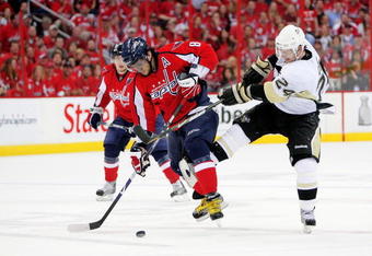 WASHINGTON - MAY 02:  Alex Ovechkin #8 of the Washington Capitals battles Matt Cooke #24 of the Pittsburgh Penguins during Game One of the Eastern Conference Semifinal Round of the 2009 Stanley Cup Playoffs on May 2, 2009 at the Verizon Center in Washington,  DC.  (Photo by Len Redkoles/Getty Images)
