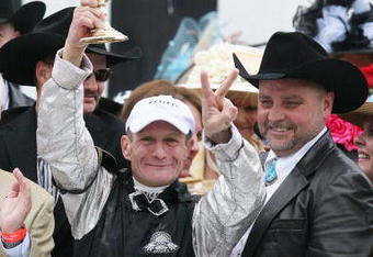 LOUISVILLE, KY - MAY 02:  (L) Jockey Calvin Borel holds the 135th Kentucky Derby trophy after his win atop Mine That Bird as owner (R) Mark Allen looks on in the winner's circle on May 2, 2009 at Churchill Downs in Louisville, Kentucky.  (Photo by Andy Lyons/Getty Images)