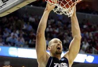MEMPHIS, TN - MARCH 27:  Josh Heytvelt #42 of the Gonzaga Bulldogs dunks the ball over Deon Thompson #21 of the North Carolina Tar Heels in the first half during the NCAA Men's Basketball Tournament South Regionals at the FedExForum on March 27, 2009 in Memphis, Tennessee.  (Photo by Joe Murphy/Getty Images)
