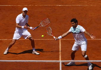ROME - MAY 03:  Daniel Nestor of Canada (L) and Nenad Zimonjic of Serbia in action in their doubles final against Bob Bryan and Mike Bryan during day seven of the Foro Italico Tennis Masters on May 3, 2009 in Rome, Italy.  (Photo by Julian Finney/Getty Images)