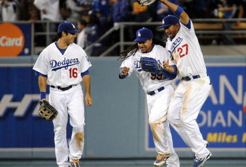 LOS ANGELES, CA - APRIL 30: Matt Kemp #27 of the Los Angeles Dodgers celebrates a 8-5 win with Manny Ramirez #99 and Andre Ethier #16 over the San Diego Padres after the ninth inning at Dodger Stadium on April 30, 2009 in Los Angeles, California. The Dodgers would win 8-5. (Photo by Harry How/Getty Images)