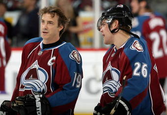 DENVER - NOVEMBER 26:  Joe Sakic #19 and Paul Stastny #26 of the Colorado Avalanche chat during warm ups prior to facing the St. Louis Blues during NHL action at the Pepsi Center November 26, 2008 in Denver, Colorado.  (Photo by Doug Pensinger/Getty Images)