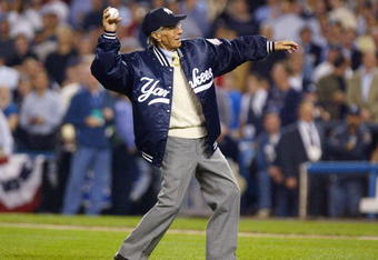 BRONX, NY - OCTOBER 9:  Yankee great Phil Rizzuto throws out the game's first pitch to former teammate Yogi Berra during game 2 of the American League Championship Series between the New York Yankees and Boston Red Sox on October 9, 2003 at Yankee Stadium in the Bronx, New York.  (Photo by Al Bello/Getty Images)