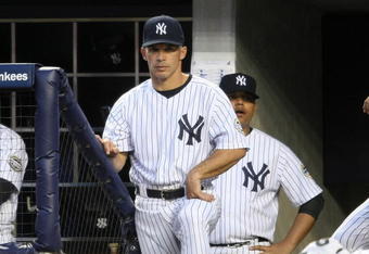 NEW YORK - APRIL 18: Manager of the New York Yankees, Joe Girardi #27 watches on from the dugout against of the Cleveland Indians at Yankee Stadium on April 18, 2009 in the Bronx borough of New York City. (Photo by Nick Laham/Getty Images)