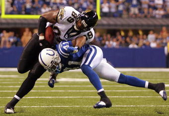 INDIANAPOLIS - SEPTEMBER 21:  Tight end Marcedes Lewis #89 of the Jacksonville Jaguars is tackled by Antoine Bethea #41 of the Indianapolis Colts on September 21, 2008 at Lucas Oil Stadium in Indianapolis, Indiana.  (Photo by Ronald Martinez/Getty Images)