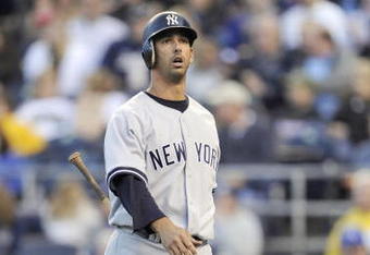 KANSAS CITY, MO - APRIL 11:  Jorge Posada #20 of the New York Yankees walks to the dugout after striking out against the Kansas City Royals on April 11, 2009 at Kauffman Stadium in Kansas City, Missouri. (Photo by G. Newman Lowrance/Getty Images)