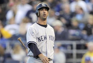 KANSAS CITY, MO - APRIL 11:  Jorge Posada #20 of the New York Yankees walks to the dugout after striking out against the Kansas City Royals on April 11, 2009 at Kauffman Stadium in Kansas City, Missouri. (Photo by G. Newman Lowrance/Getty Images)