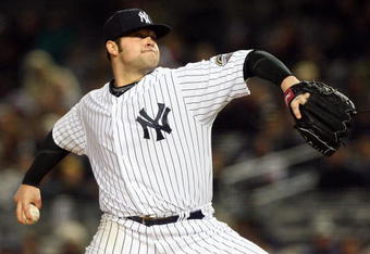 NEW YORK - MAY 05:  Joba Chamberlain #62 of the New York Yankees deals a pitch against the Boston Red Sox on May 5, 2009 at Yankee Stadium in the Bronx borough of New York City.  (Photo by Jim McIsaac/Getty Images)