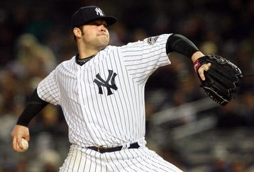 NEW YORK - MAY 05:  Joba Chamberlain #62 of the New York Yankees deals a pitch against the Boston Red Sox on May 5, 2009 at Yankee Stadium in the Bronx borough of New York City.  (Photo by Jim McIsaac/Getty Images)