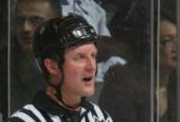 TORONTO - JANUARY 15:  Linesman Greg Devorski and referees Brad Watson and Kevin Pollock have a meeting during the Carolina Hurricanes game against the Toronto Maple Leafs at Air Canada Centre on January 15, 2008 in Toronto, Ontario. (Photo by Dave Sandford/Getty Images)