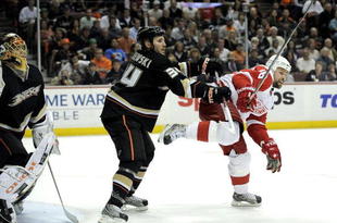 ANAHEIM, CA - MAY 05:  Goaltender Jonas Hiller #1 and James Wisniewski #34  of the Anaheim Ducks defend the goals against Tomas Holmstrom #96 of the Detroit Red Wings during Game Three of the Western Conference Semifinal Round of the 2009 Stanley Cup Playoffs at the Honda Center on May 5, 2009 in Anaheim, California. (Photo by Kevork Djansezianl/Getty Images)