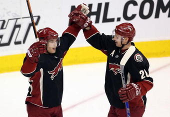 GLENDALE, AZ - APRIL 11:  (L-R) Scottie Upshall #8 and Steve Reinprecht #28 of the Phoenix Coyotes celebrate after Reinprecht scored a second period power play goal against the Anaheim Ducks during the NHL game at Jobing.com Arena on April 11, 2009 in Glendale, Arizona.   The Coyotes defeated the Ducks in 5-4 in an overtime shootout.  (Photo by Christian Petersen/Getty Images)