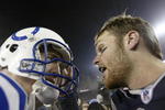 FOXBORO, MA - JANUARY 18:   Quarterback Tom Brady #12 of the New England Patriots speaks with Quarterback Peyton Manning #18 of the Indianapolis Colts after the  AFC Championship Game on January 18, 2004 at Gillette Stadium in Foxboro, Massachusetts. The Patriots defeated the Colts 24-14. (Photo by Elsa/Getty Images)
